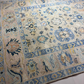 Decorative rug with intricate patterns on a neutral background