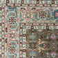 Close-up of an intricately designed rug with floral patterns.