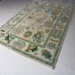 Decorative rug with cartoon-like designs on a white floor