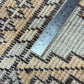 Patterned carpet with a ruler for scale