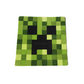 Green pixelated rug with a black face design on a white background