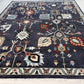 Decorative rug with intricate patterns on a blue background
