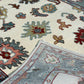 Close-up of a patterned rug with floral designs in various colors.