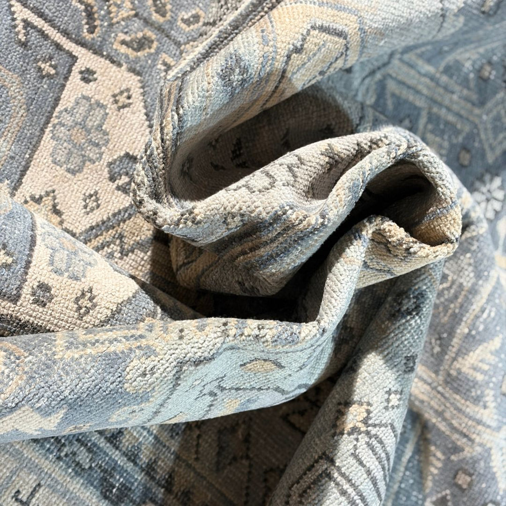 Close-up of textured fabric with intricate patterns on a matching background
