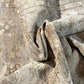 Close-up of textured fabric with a neutral color palette
