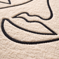 Close-up of a textured surface with black line art design