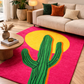 Living room with a colorful rug featuring a cactus design on a pink background.
