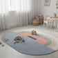 Children's playroom with a colorful rug featuring geometric shapes, toys, and a chair.