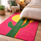 Colorful cactus rug on a wooden floor in a bedroom setting