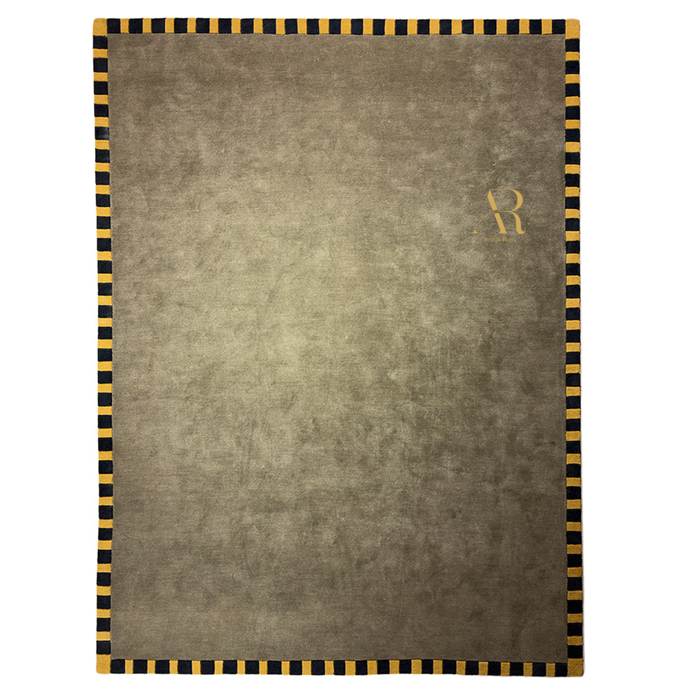 A green rug with yellow and black border in a room.