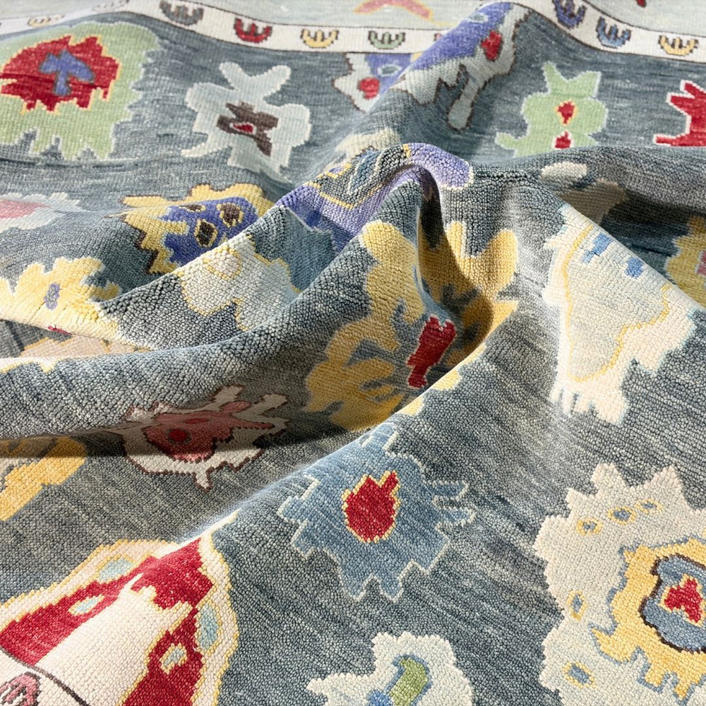 Close-up of patterned fabric with blue, red, yellow, and white colors.