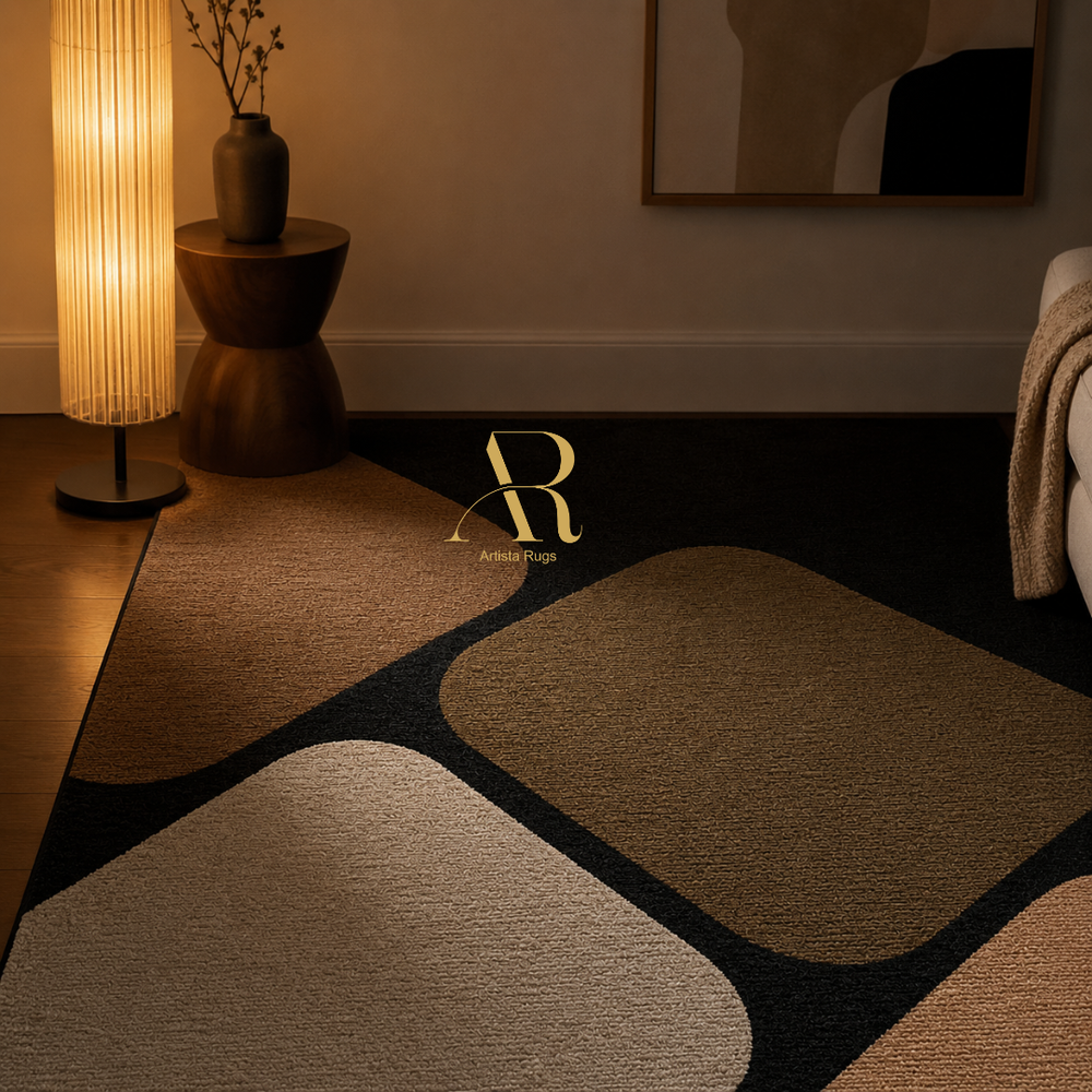 A modern area rug with an abstract geometric pattern in beige, brown, and black, styled in a warm, dimly lit living room next to a glowing floor lamp.