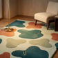 Colorful abstract rug with a chair and lamp in a room setting