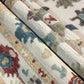 Close-up of patterned rugs with geometric designs in various colors.