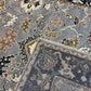 Close-up of a patterned rug with intricate designs.
