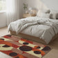 Bedroom with a colorful abstract rug on the floor