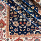 Close-up of patterned rugs with intricate designs in various colors.