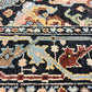 Close-up of an intricately designed rug with floral patterns.