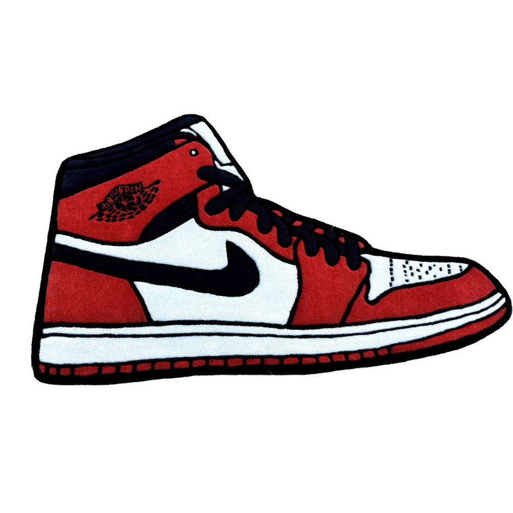 Red and black sneaker with a white logo on a white background