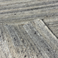 Close-up of textured concrete surface with visible cracks and patterns