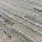 Close-up of textured gray and white carpet
