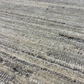 Close-up of textured stone surface with horizontal lines