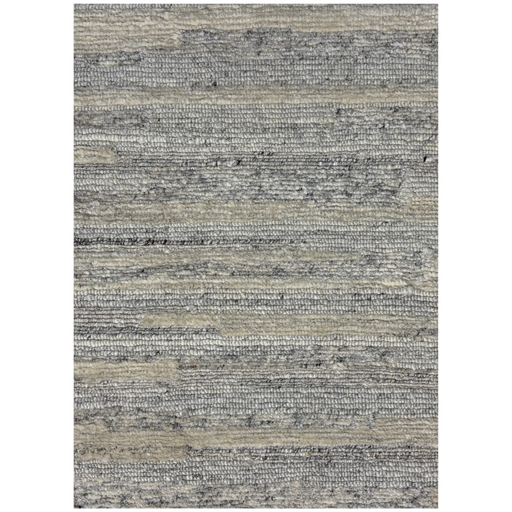 Textured area rug with a neutral color palette on a white background