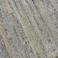 Close-up of textured gray and beige carpet