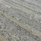 Close-up of textured gray and beige carpet
