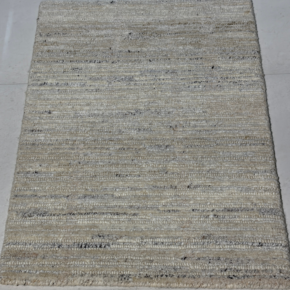 Textured area rug on a plain background