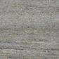 Close-up of textured gray fabric with a subtle pattern