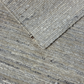 Close-up of textured gray carpet with a slight pattern