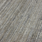 Close-up of textured beige and brown carpet