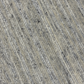 Close-up of textured beige carpet with subtle pattern