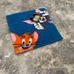 Towel with cartoon characters on a textured surface