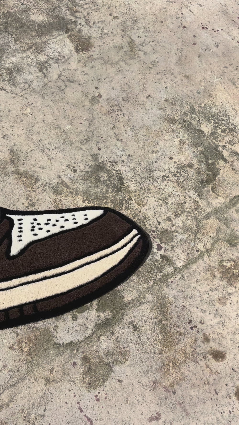 Brown and white sneaker with a prominent Nike logo on a white background