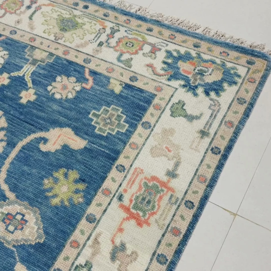 Close-up of a patterned rug with a visible textures.