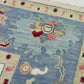 Close-up of a patterned rug with a visible brand label.
