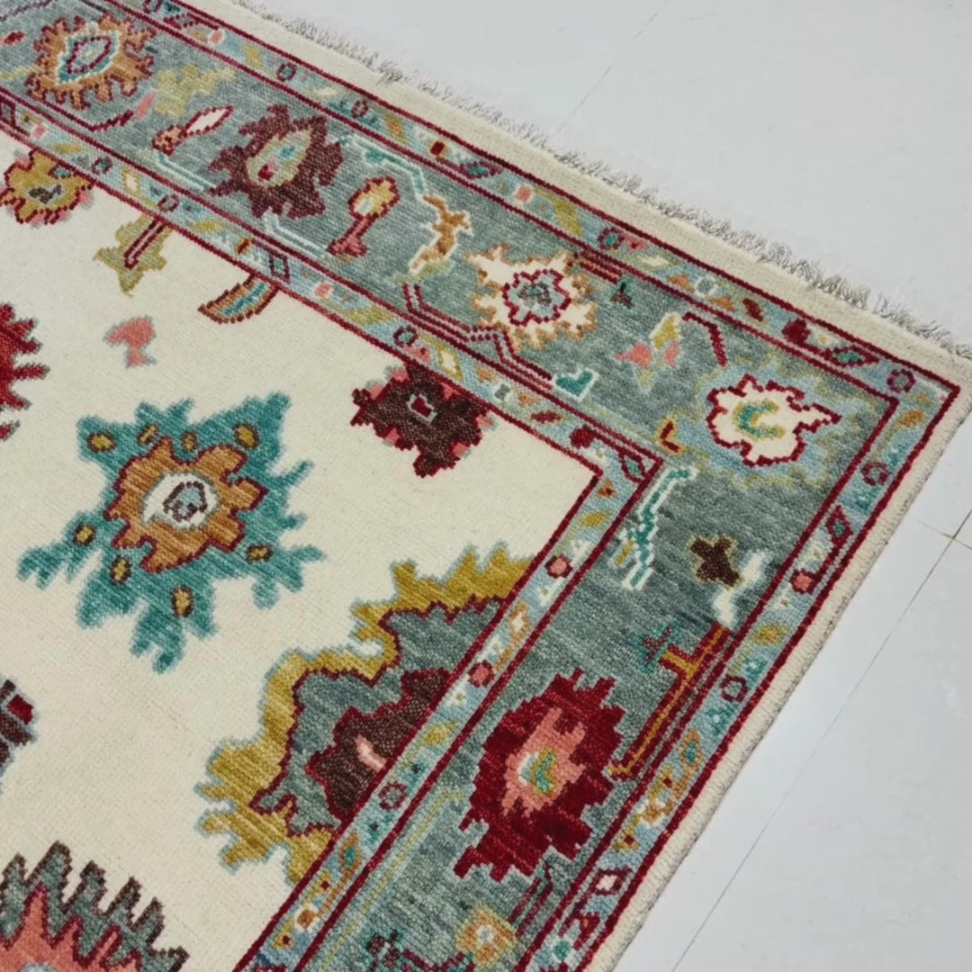 Close-up of a patterned rug with a visible textures.