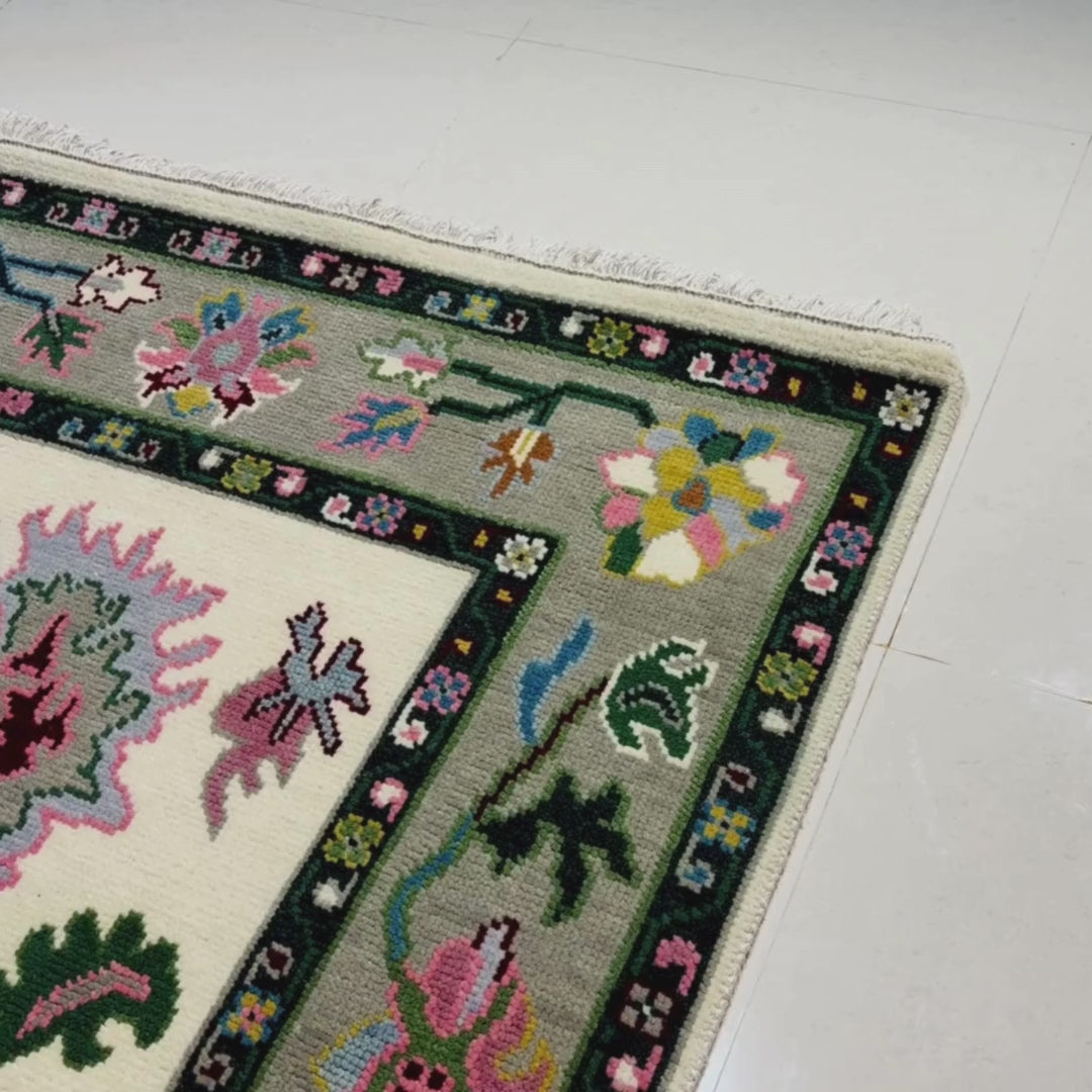 Rug with floral patterns and a ruler for scale