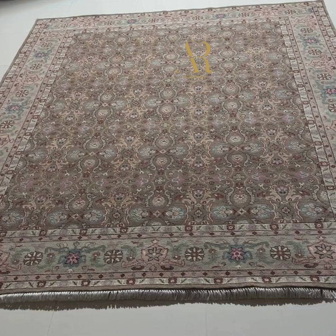 Decorative rug with intricate patterns on a plain background