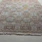 Close-up of a patterned rug with geometric designs.