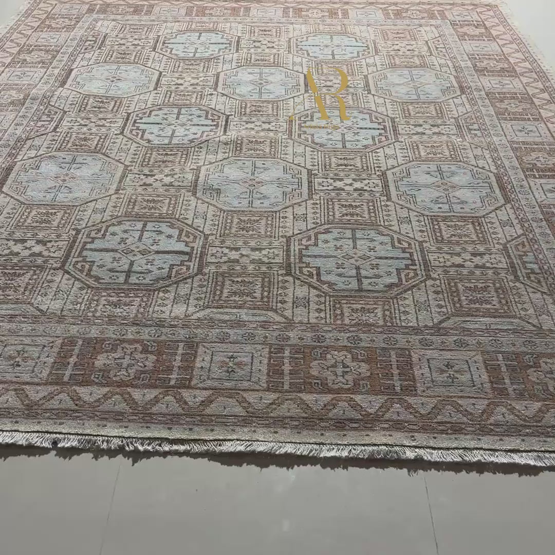Close-up of a patterned rug with geometric designs.