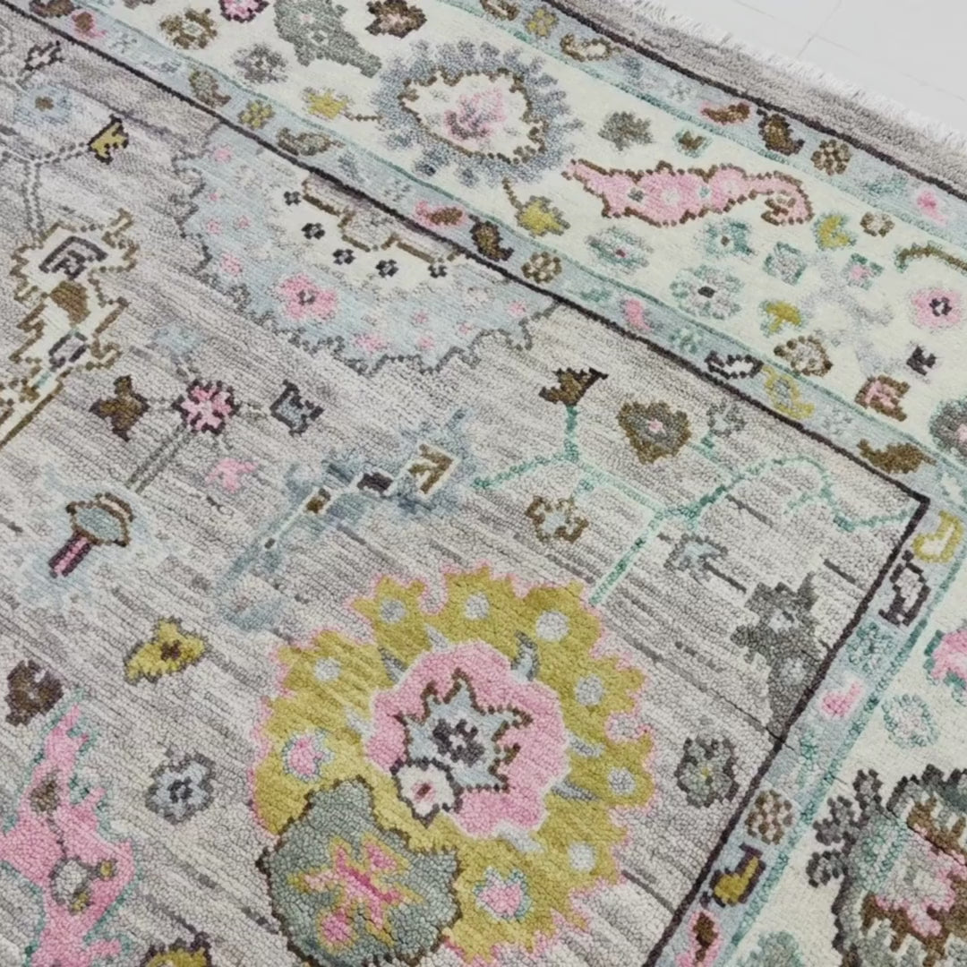 Close-up of a patterned rug with a visible textures.