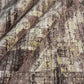 Close-up of a patterned rug with a visible textures.