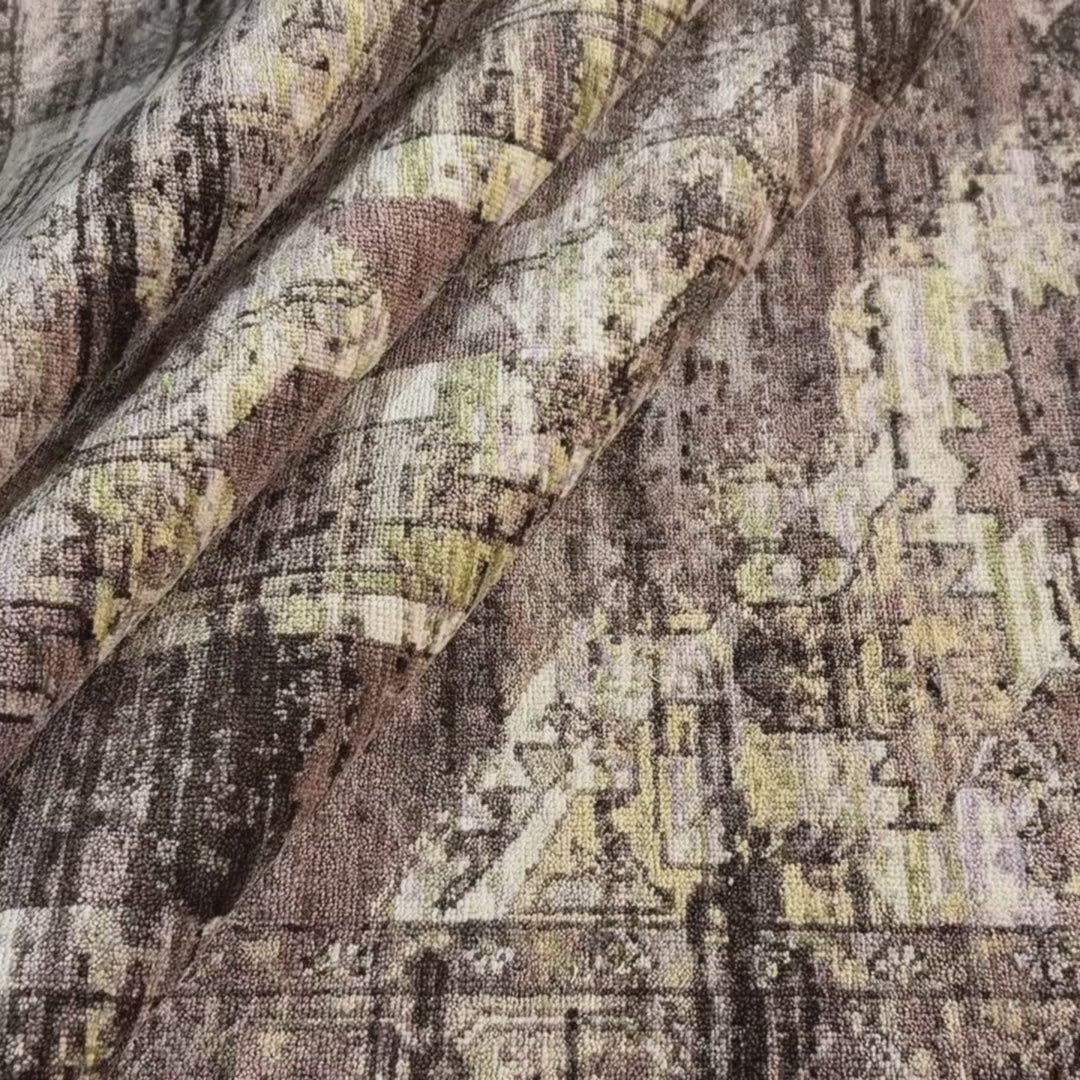 Close-up of a patterned rug with a visible textures.