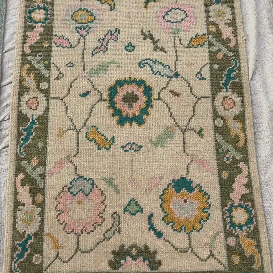 Floral patterned rug with colorful flowers on a neutral background