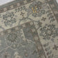 Patterned rug with a visible brand label on a tiled floor