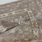 Close-up of a patterned rug with a visible textures.