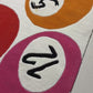Rug with colorful circles and numbers on a white background